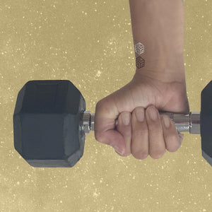 woman holding dumbbell weight wearing three strength mindful mars on her wrist.