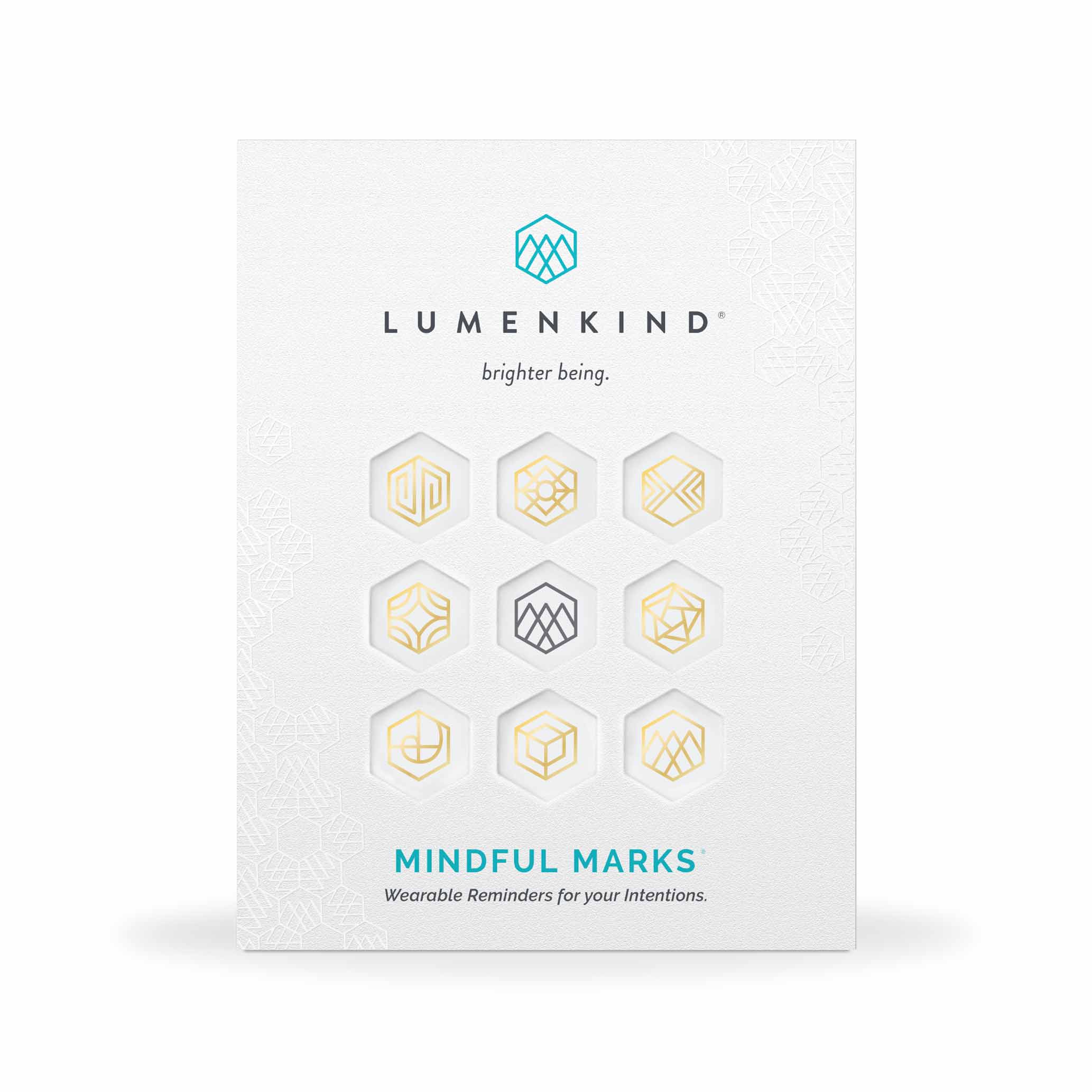 The front side of a pack of Mindful Marks —Balance Collection (Gold), wearable reminders for your intentions.