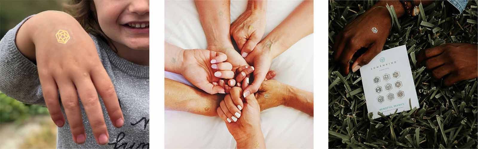 Close up of smiling girl's hand lifted up, group of ladies holding hands, and man siting on lawn, all wearing mindful marks.